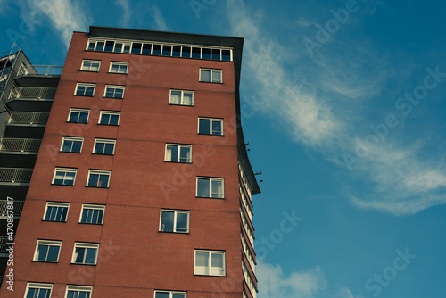 high brick building with blue sky