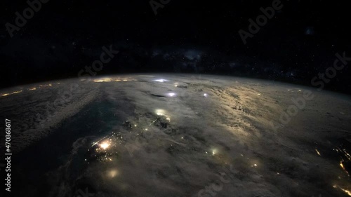 Stormy weather on planet earth night lights satellite view from space time lapse, thunder and lightning. Based on images furnished by Nasa