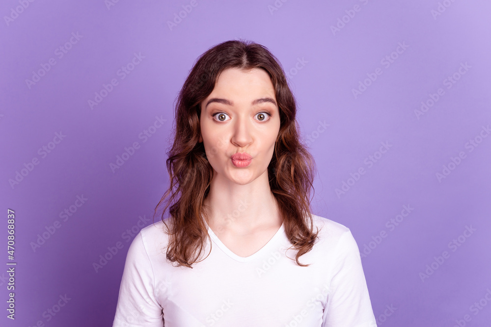 Photo of young pretty girl pouted lips send air kiss romantic date isolated over purple color background Photo of young pretty girl pouted lips send air kiss romantic date isolated over purple color background