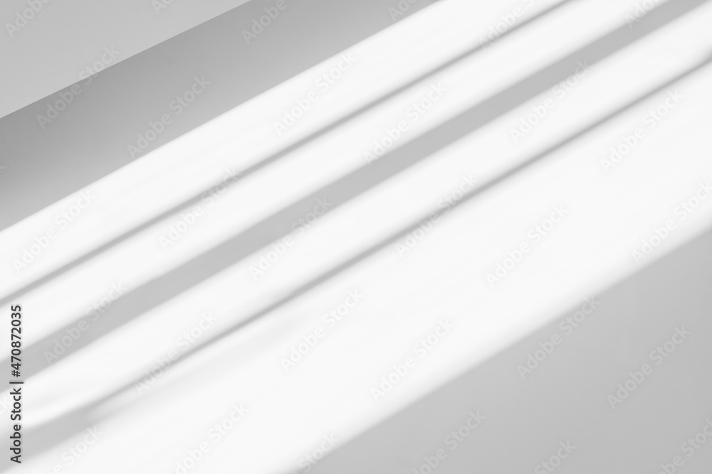 Obraz premium Abstract shadow and striped diagonal light background on white wall from window, architecture dark gray and sunshine diagonal geometric effect overlay for backdrop and design