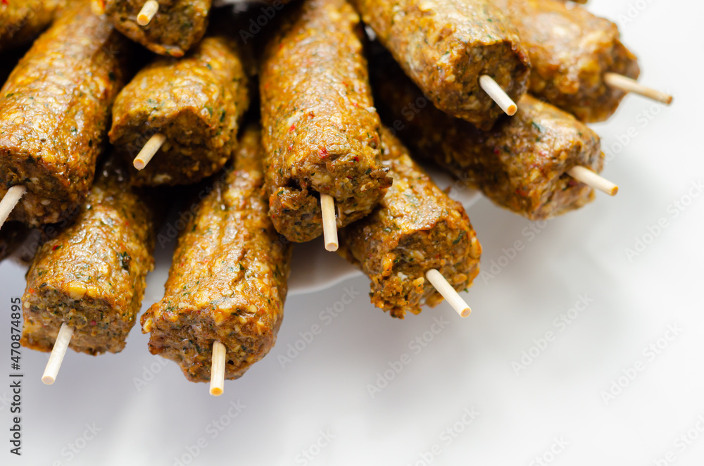 Minced and shaped lamb kebabs with chilli and coriander prepared for grill Minced and shaped lamb kebabs with chilli and coriander prepared for grill