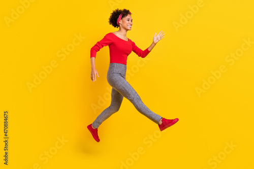 Profile photo of positive lady jump show enjoy flight journey wear pin-up outfit headband isolated yellow color background