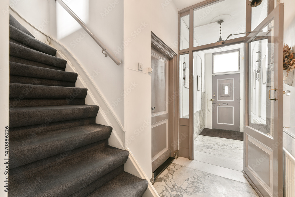 Staircase in modern apartment with doors Staircase in modern apartment with doors