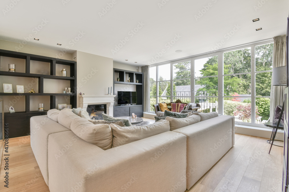 Large sofa in living room in apartment in daytime Large sofa in living room in apartment in daytime