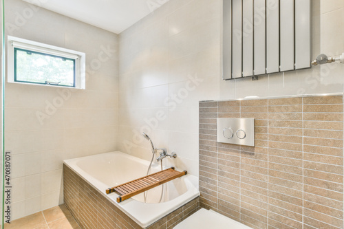 Interior of bathroom with tub photo