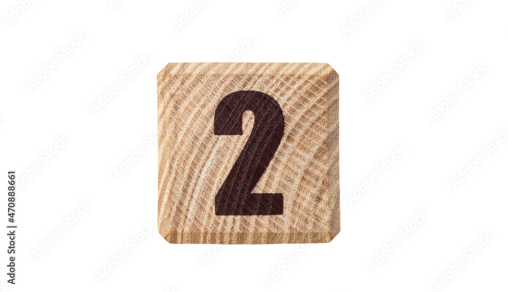 Wooden cube with the inscription 2 isolated on a white background. Wooden cube with the inscription 2 isolated on a white background.