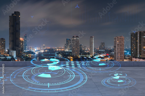 Rooftop with concrete terrace, Bangkok night skyline. Hi tech digital holograms to optimize business process by applying new technologies. City downtown. Double exposure.