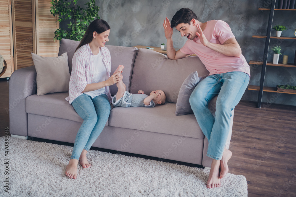 Portrait of attractive cheerful life partners babysitting playing having fun good mood rest fooling morning at home indoors Portrait of attractive cheerful life partners babysitting playing having fun good mood rest fooling morning at home indoors