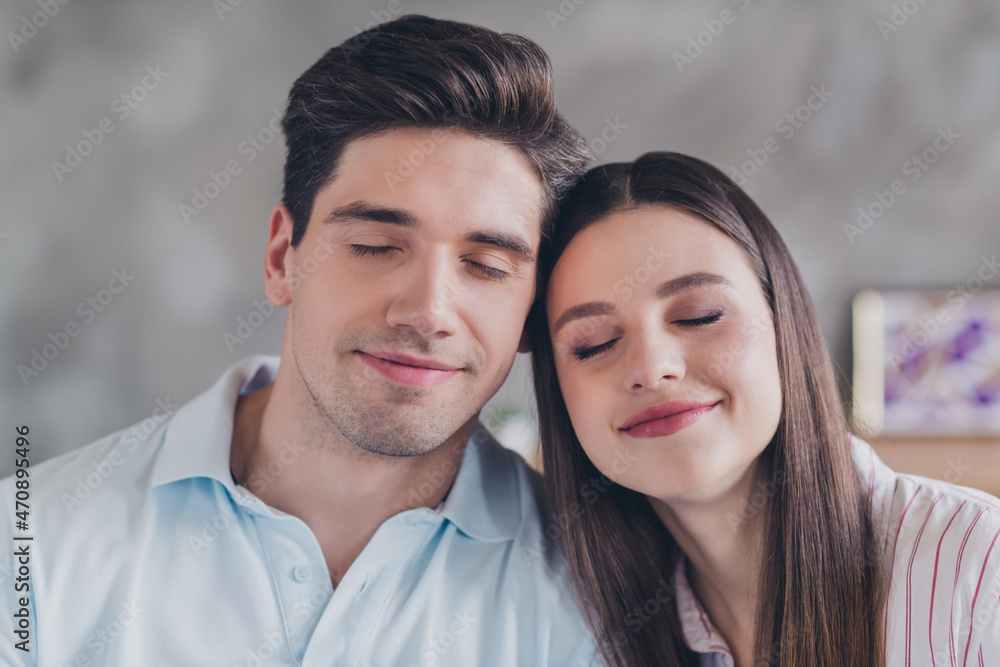 Portrait of attractive dreamy calm peaceful couple bonding enjoying pastime weekend day at home indoors Portrait of attractive dreamy calm peaceful couple bonding enjoying pastime weekend day at home indoors