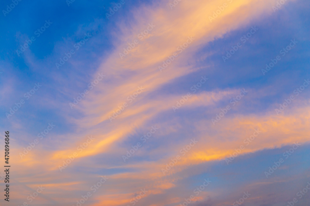 Fototapeta premium Abstract nature background. Dramatic blue sky with orange colorful sunset clouds in twilight time