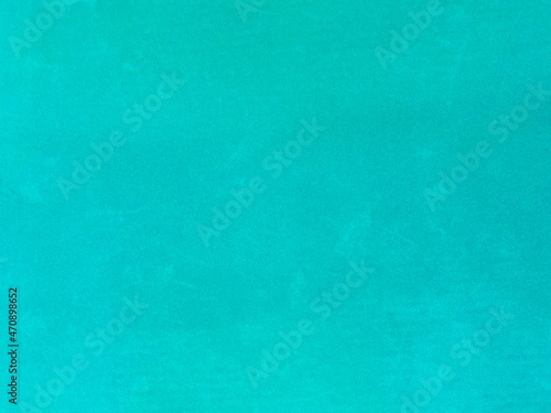 turquoise old velvet fabric texture used as background. Empty turquoise fabric background of soft and smooth textile material. There is space for text..