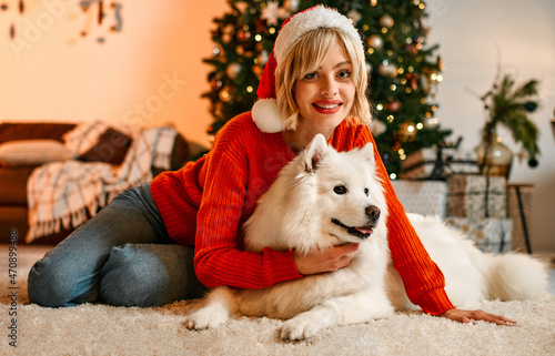 Couple in love for New Year and Christmas with a dog at home © Valerii Apetroaiei