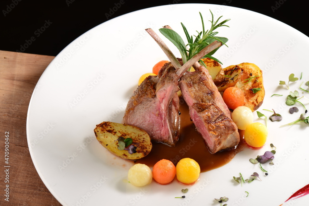 Fine dining, roasted Lamb chops with potato, rosemary and vegetable sauce Fine dining, roasted Lamb chops with potato, rosemary and vegetable sauce
