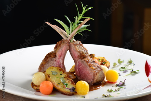 Fine dining, roasted Lamb chops with potato, rosemary and vegetable sauce