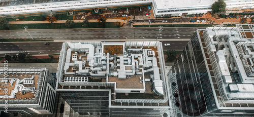 Aerial view of HVAC system on the roof top. Complex air conditioning system with pipes on the top of the office building. © AlexGo