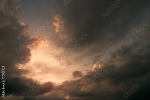 Heaven sky during sunset. Summer sky full of orange sunlight