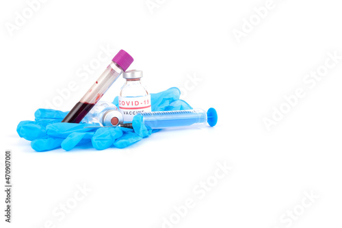 Protection against coronavirus (COVID-19), blue medical gloves, syringe and needle, vaccination against virus