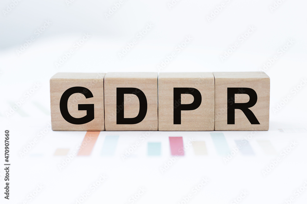 GDPR message on wood cube dices on aged table. GDPR message on wood cube dices on aged table.