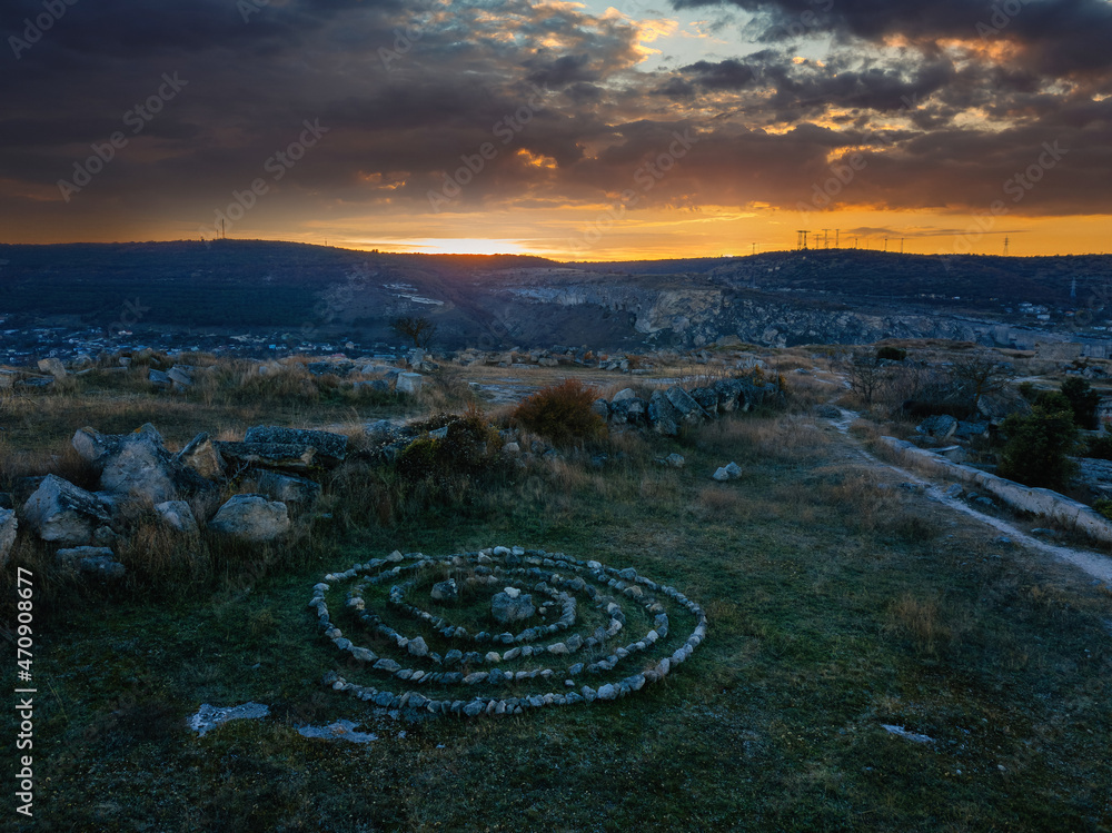 Spiral labyrinth made of stones at the sunset Spiral labyrinth made of stones at the sunset