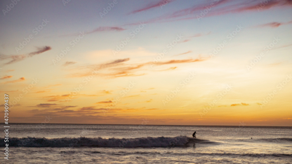 Surfing at sunset 