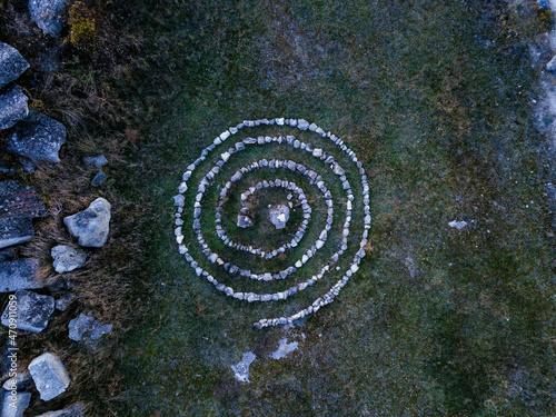 Spiral labyrinth made of stones, top view from drone photo
