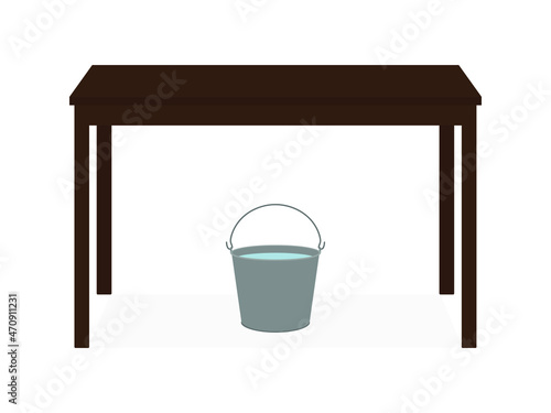 A bucket of water stands under the table on a white background