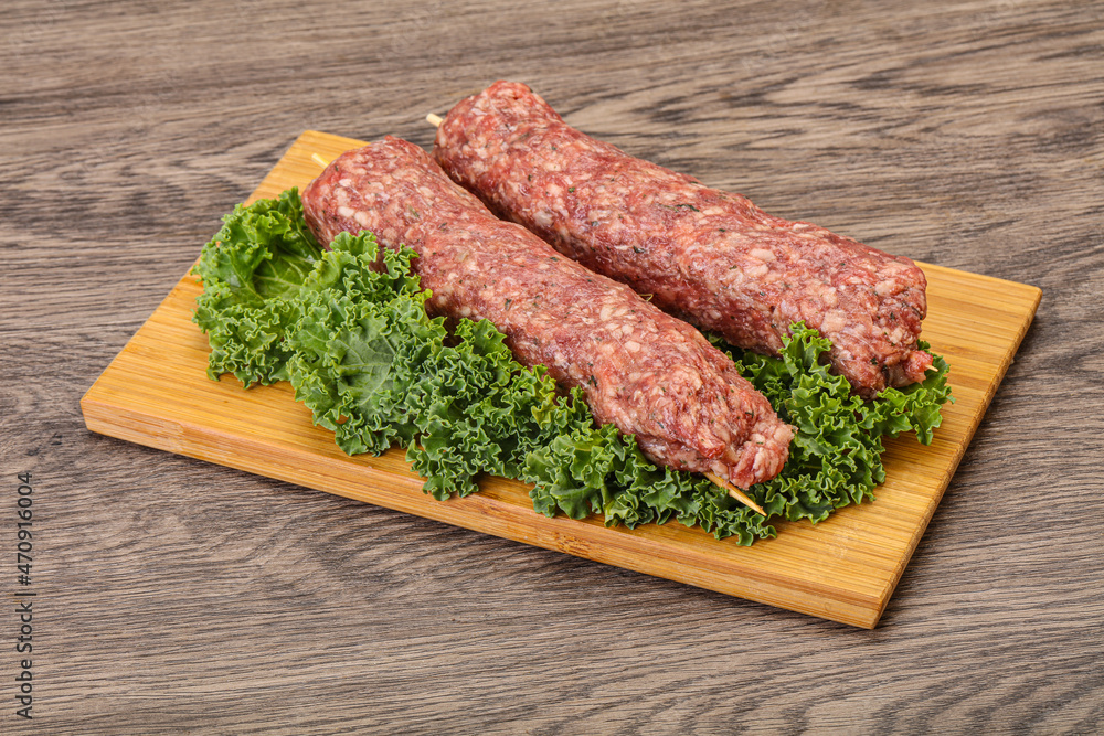 Raw minced beef kebab skewer