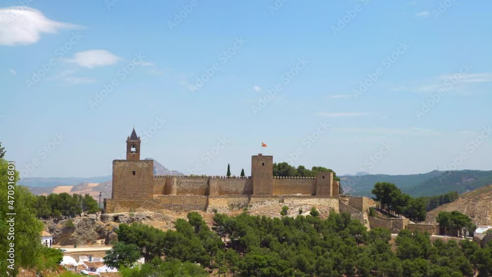 View of the Alcazaba of Antequera is a Moorish fortress in Spain. Castle medieval in Malaga. Arab fortress architecture building among the hills in Andalusia.-Dan View of the Alcazaba of Antequera is a Moorish fortress in Spain. Castle medieval in Malaga. Arab fortress architecture building among the hills in Andalusia.-Dan