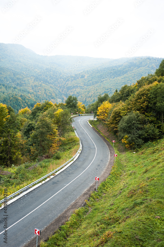 Asphalt road in the autumn mountain Asphalt road in the autumn mountain