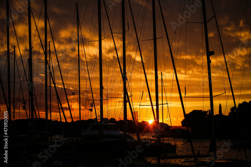 Beautiful sunset under the silhouettes of masts in Croatia