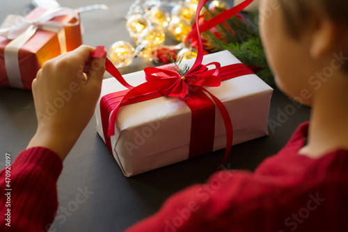 Boy preparing presents for Christmas or new year