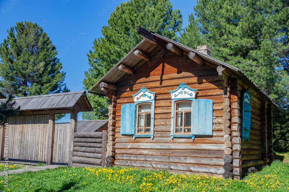 Facade of an old house made of Siberian larch on the shore of Lake Baikal. Facade of an old house made of Siberian larch on the shore of Lake Baikal.