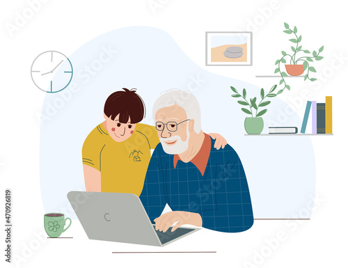 Happy grandpa with a laptop. The old man sits with his grandson at the computer. Grandson with grandfother using laptop social media network online communication concept
