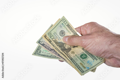 Hand giving or paying money, US dollar bills