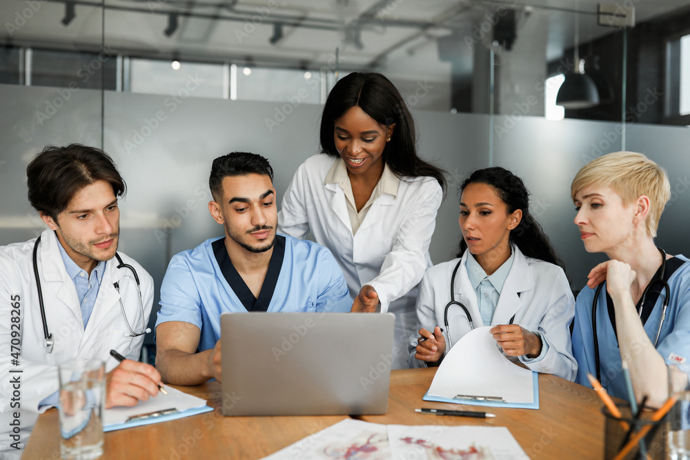 Professional multiethnic team of doctors having video call with patient Professional multiethnic team of doctors having video call with patient