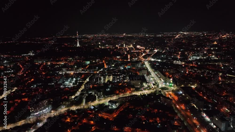 Panorama of the night city from a height. Night lights illuminating the streets and roads of a large European city. Flight over the city of Lviv in Ukraine at night. Night car traffic through the city Panorama of the night city from a height. Night lights illuminating the streets and roads of a large European city. Flight over the city of Lviv in Ukraine at night. Night car traffic through the city