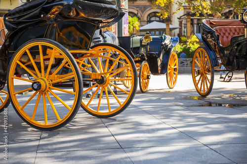 Horse carriage with wheels painted in medium yellow, buggy, typical Seville carriage photo