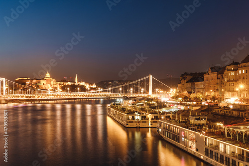 A panoramic view of the bridge and buildings in Budapest. Colorful evening view in Budapest, Hungary, Europe.