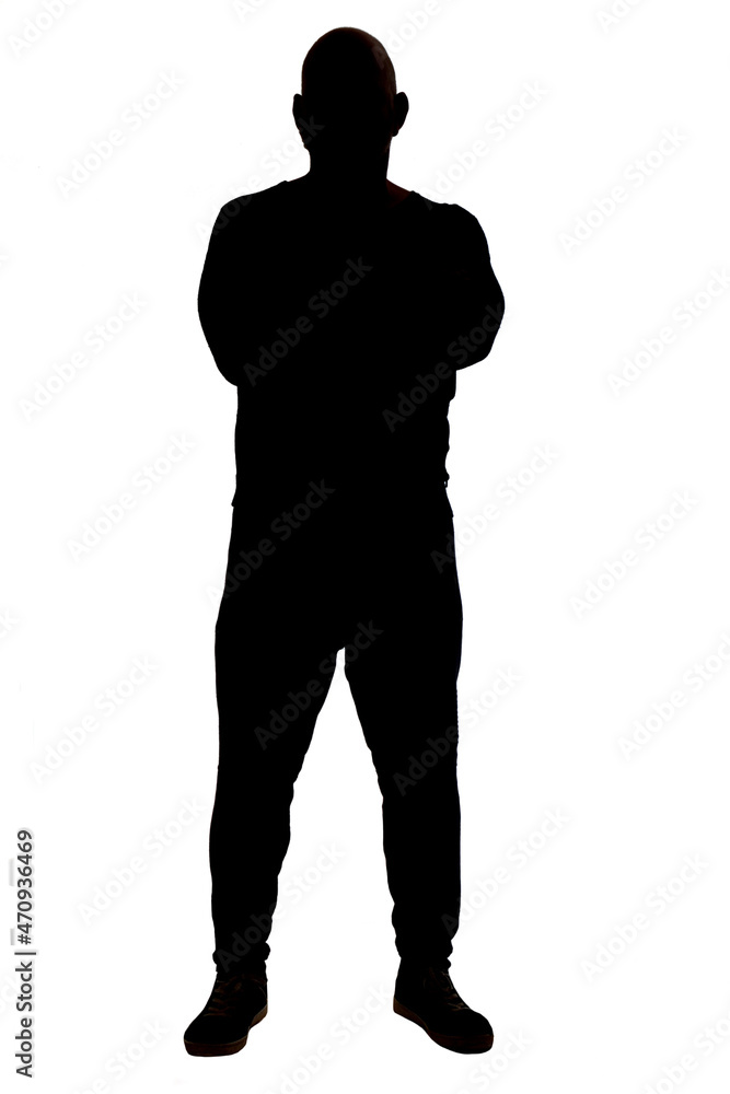 front view of the silhouette of a man wearing casual clothes with his arms crossed
