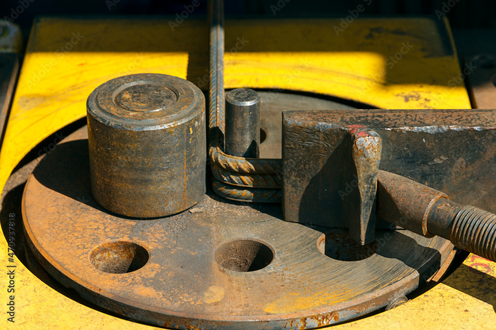 Rebars bending machine in the site. Preparation of parts from rebar