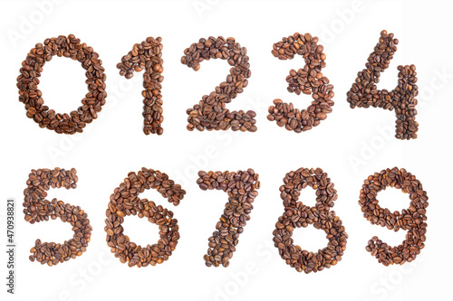 Numbers 1, 2, 3, 4, 5, 6, 7, 8, 9, 0 made from roasted coffee beans on white isolated background. Element for decoration. Numbers from 1 to 9. View from above.