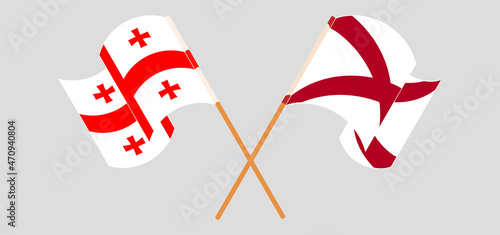 Crossed and waving flags of Georgia and The State of Alabama