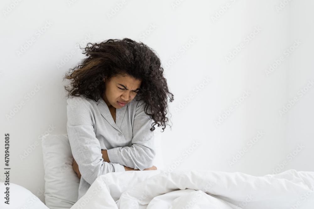 African american woman suffer from severe ache abdominal pain African american woman suffer from severe ache abdominal pain