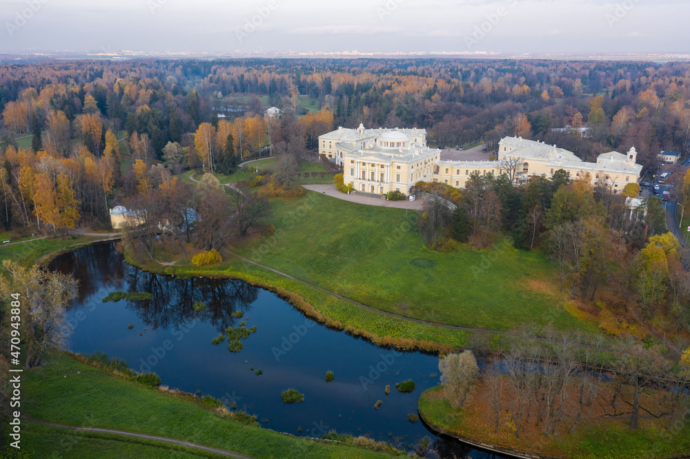 Panoramic aerial view of the Pavlovsk Park and the Pavlovsk Palace on an autumn evening.Bright autumn landscape, Slavyanka river. A suburb of St. Petersburg.