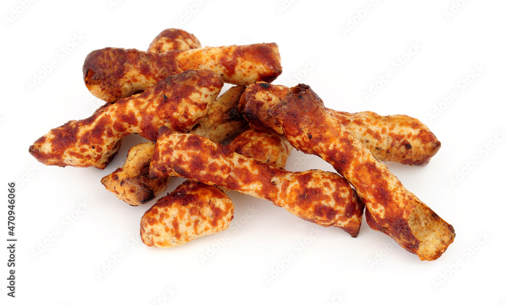 Group of crunchy knobbly twig shaped wheat savoury snacks with a yeast flavour coating Group of crunchy knobbly twig shaped wheat savoury snacks with a yeast flavour coating