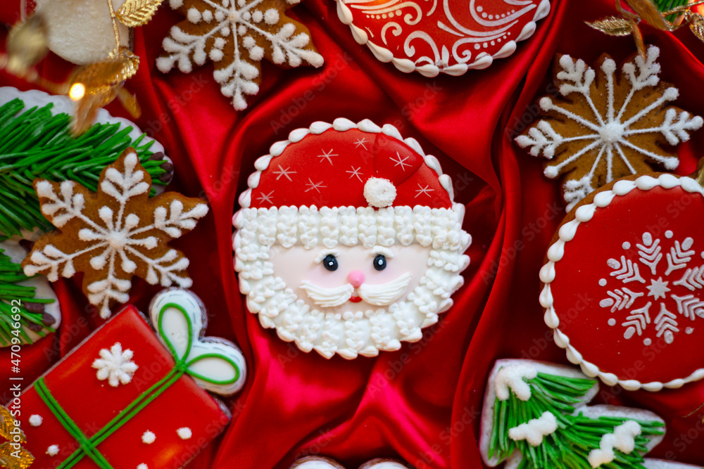 Banner for Christmas and New Year gingerbread cookies Santa Claus, snowflakes, Christmas trees, garlands on red silk fabric background