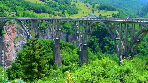 Durdevica Tara Bridge, also known as the bridge of anti fascist, hero lieutenant Bozhidar Zugic, is a concrete arch bridge over the Tara Canyon River in northern Montenegro. photo