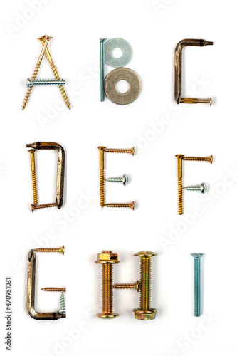 Industrial alphabet. Letters A, B, C, D, E, F, G, H, I, made of nails and screw.