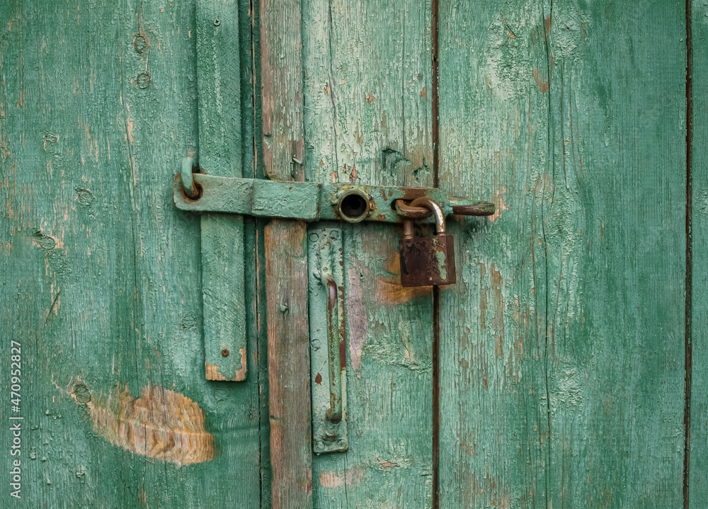 Old door with an external lock Old door with an external lock