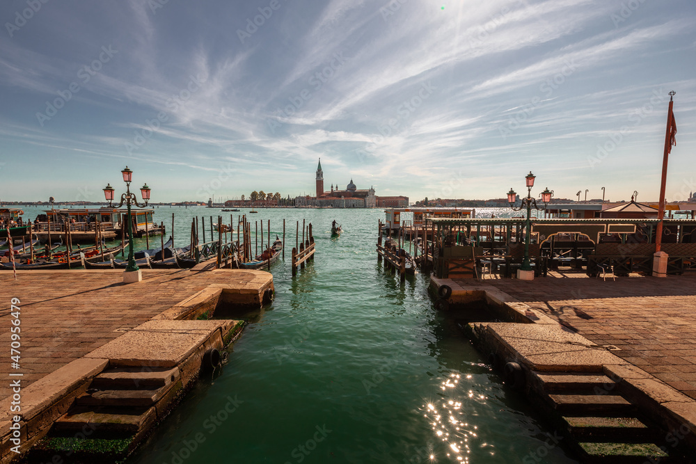 View of Venezia lagoon with the pier and San Giorgio Maggiore church, Veneto, Italy. View of Venezia lagoon with the pier and San Giorgio Maggiore church, Veneto, Italy.